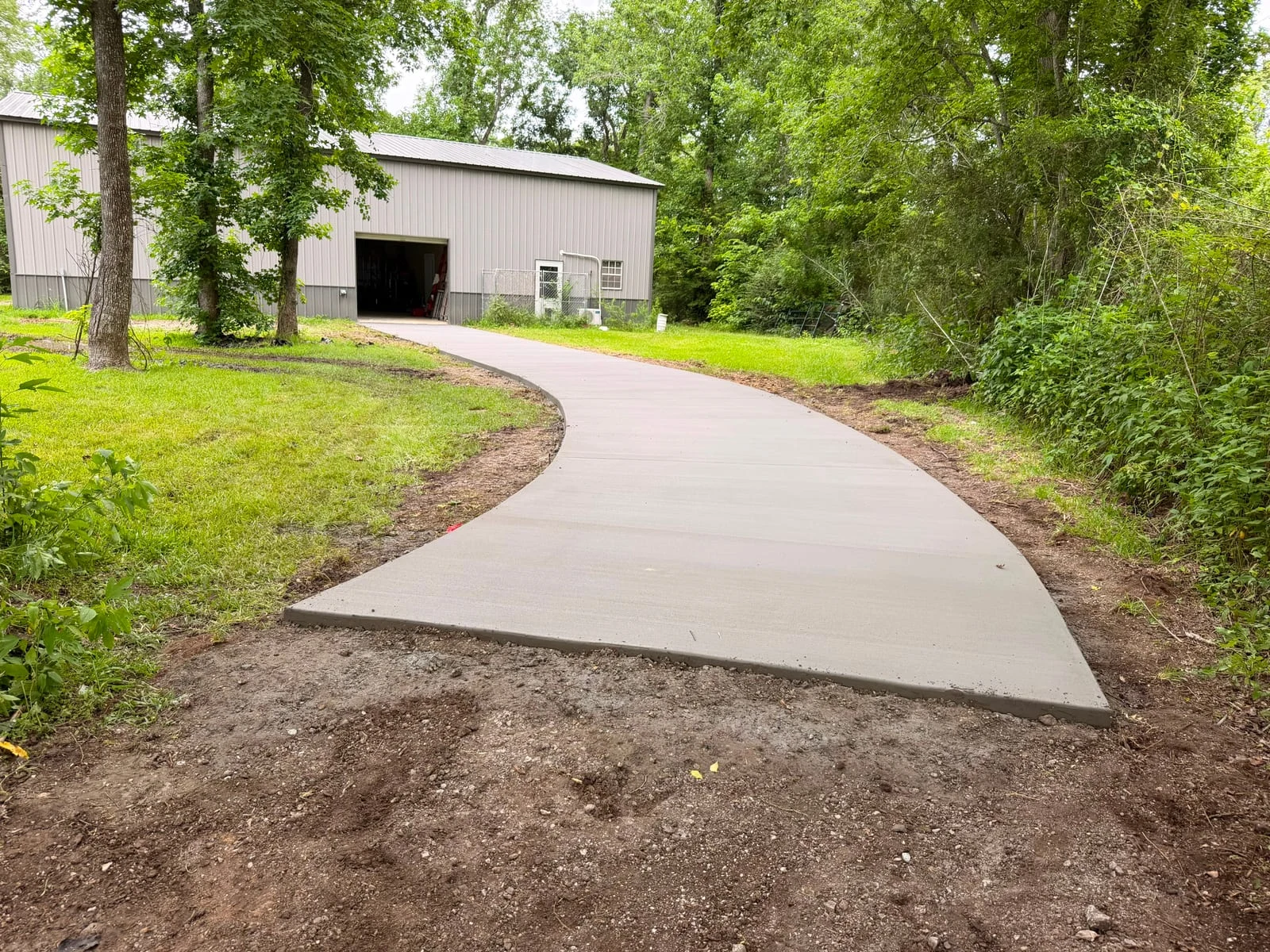A finished concrete driveway by Santoyo’s Concrete