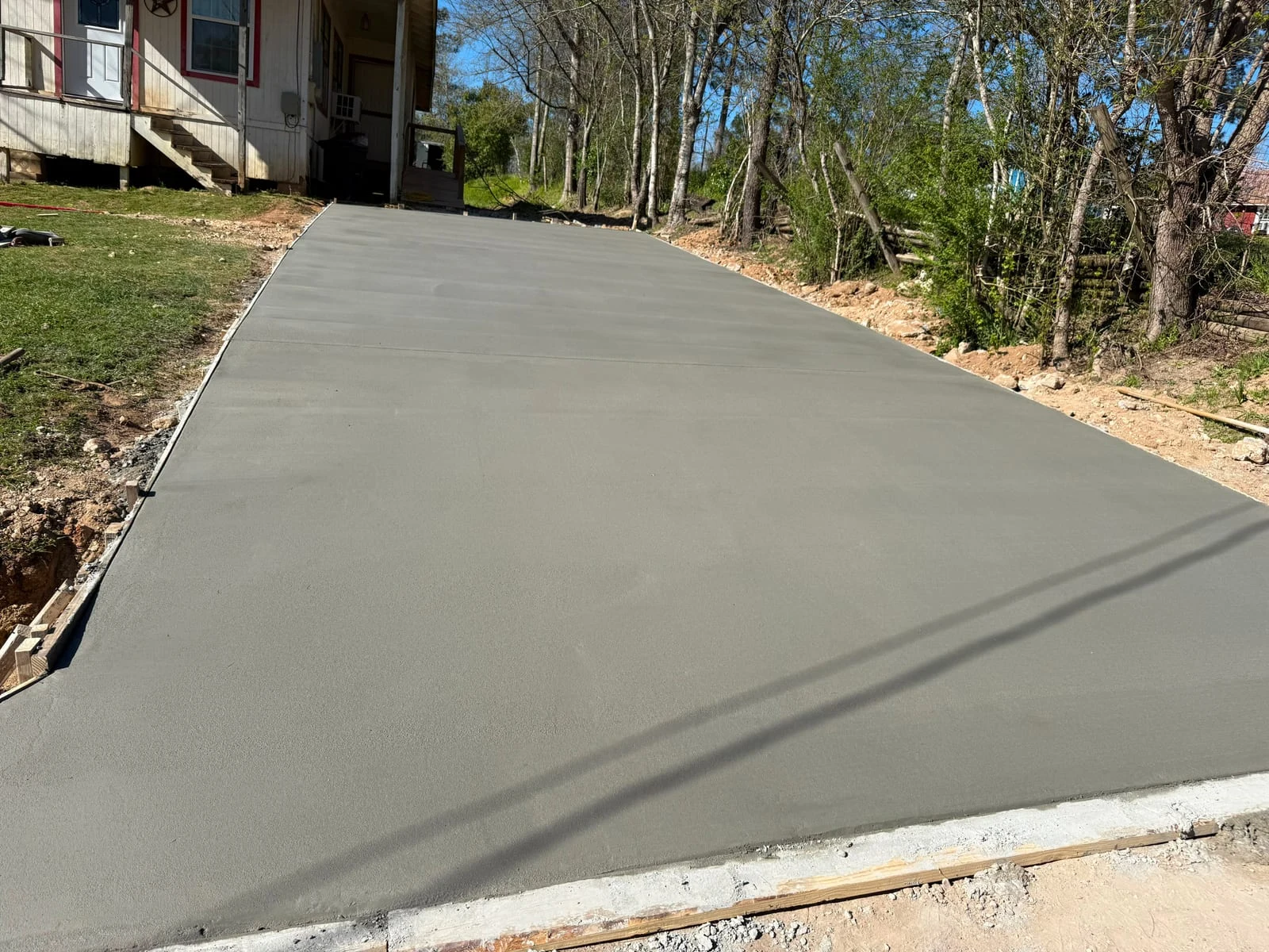 A finished concrete driveway by Santoyo’s Concrete