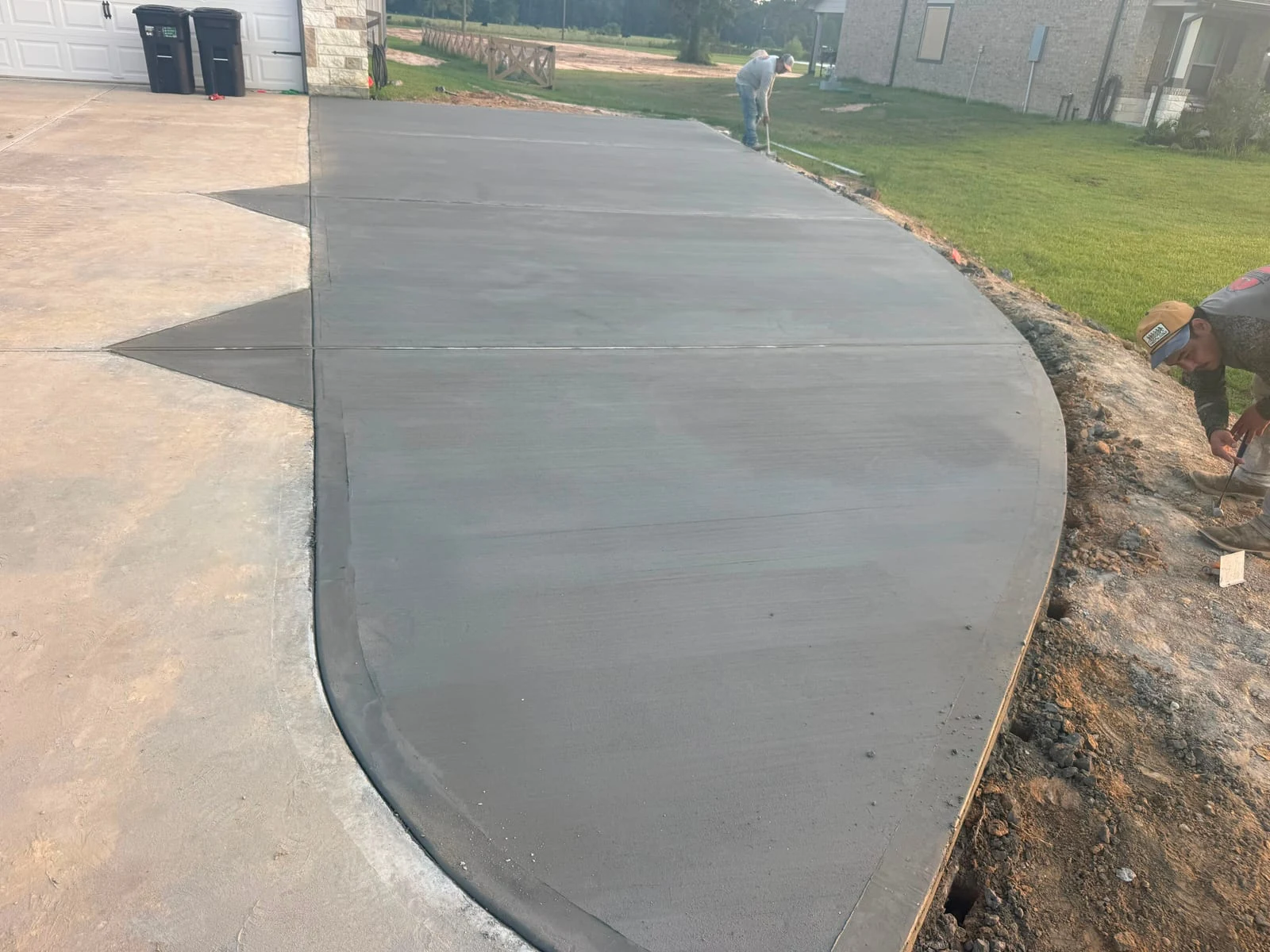 A finished concrete driveway by Santoyo’s Concrete