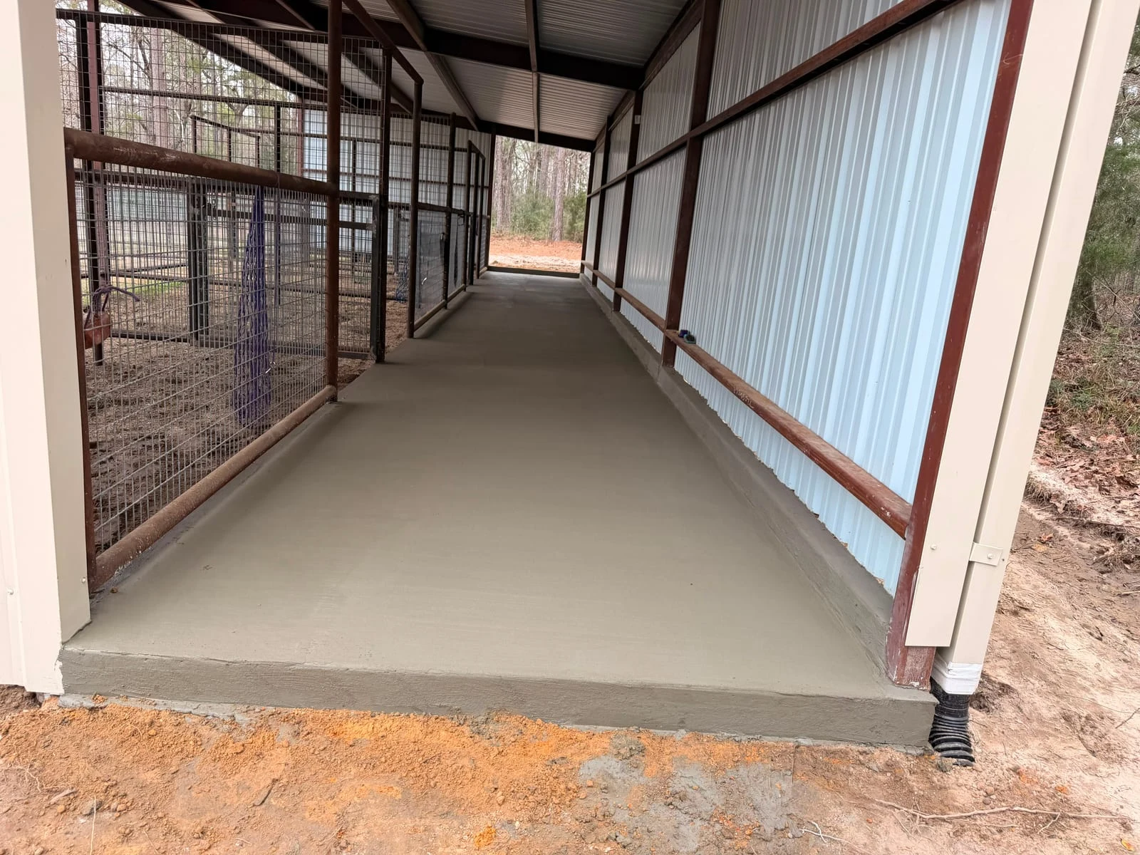 A finished concrete patio alongside a home