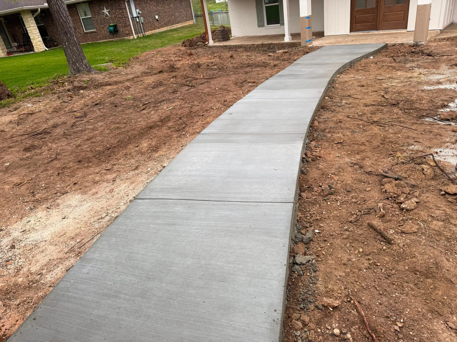 A concrete walkway by Santoyo’s Concrete